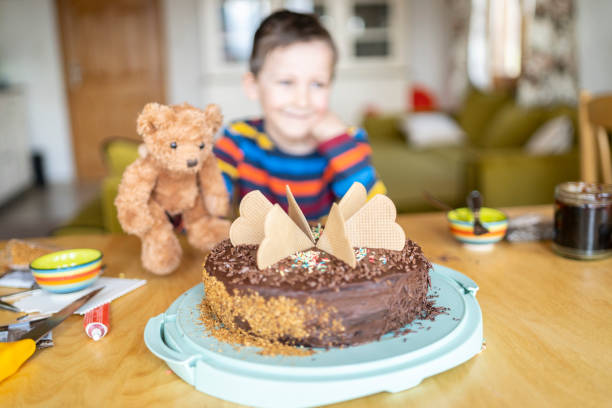 istock Defocused small boy portrait and homemade cake 1217787513