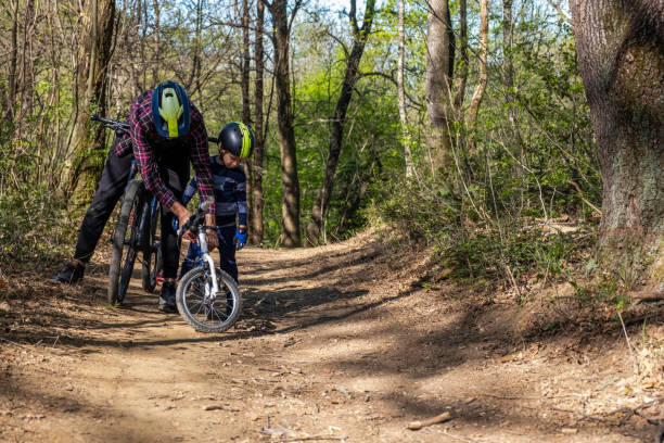 istock Father and Son MTB mountain biking in the Forest 1217790363