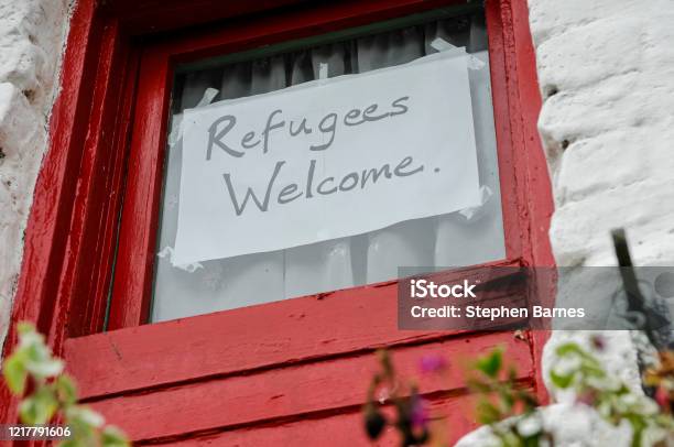 Sign On A Window Saying Refugees Welcome Stock Photo - Download Image Now - Refugee, Refugee Camp, Welcome Sign