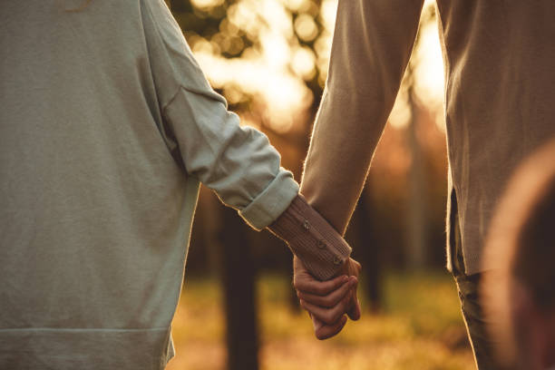 istock Heterosexual couple holding hands 1217792092