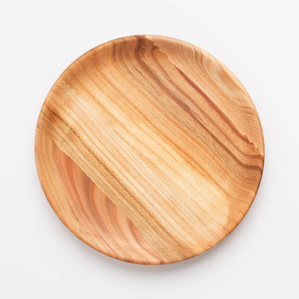 istock Wooden plate on white background, close up 1217792241
