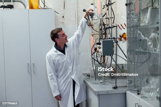 Scientist Conducts Chemical Experiments With Liquids In A Scientific Laboratory Stock Photo - Download Image Now