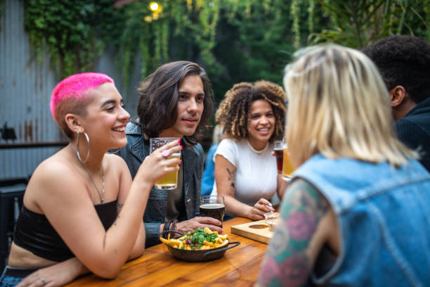istock Gathering with friends at outdoor pub 1217796887