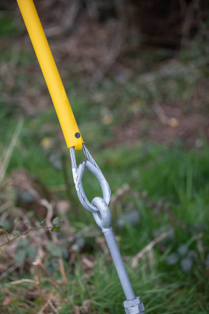 istock Metal stay securing a utility pole with yellow plastic coating 1217801929