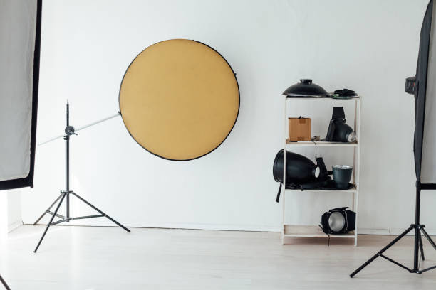 istock Photo studio accessories photographer flashes white background 1217803450