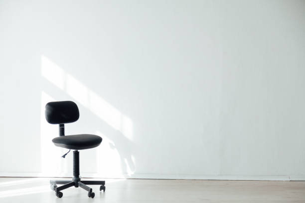 istock black office chair in an empty white office 1217803681
