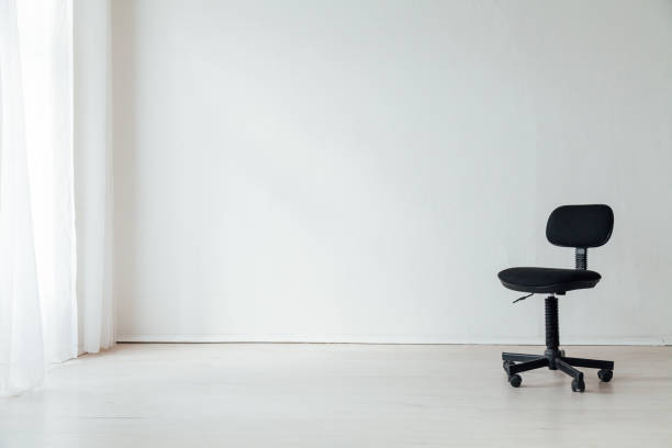 istock black office chair in an empty white office 1217803795