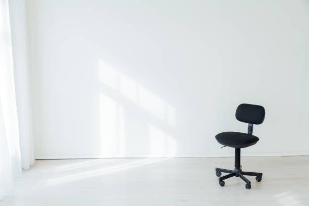 istock black office chair in an empty white office 1217803856
