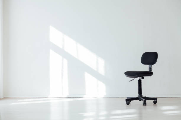 istock black office chair in an empty white office 1217803875