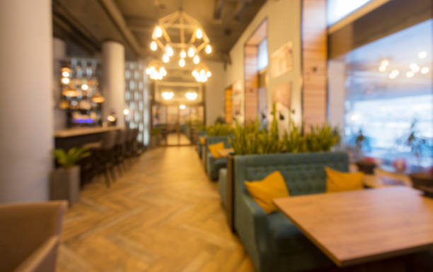 istock Blurred modern restaurant or cafe interior. Public place interior 1217803924