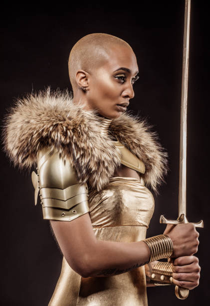 istock Golden viking inspired warrior female in studio shot 1217804254