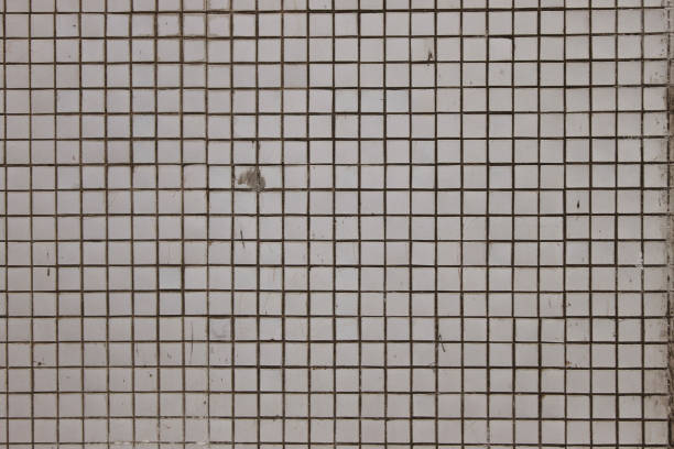 istock Wall square mosaic tiles geometric retro vintage texture. Soviet modernism aesthetic. White rough horizontal background. 1217804941