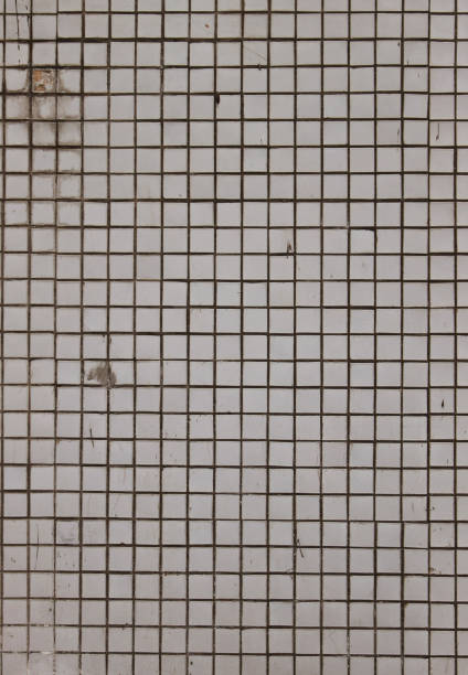 istock Stone wall square mosaic tiles geometric retro vintage texture. Soviet modernism aesthetic. White rough vertical background. 1217804942