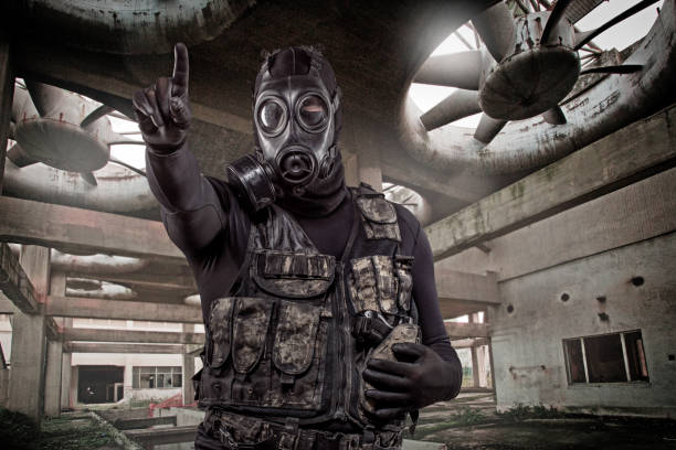 istock Gas mask wearing lone soldier 1217805493