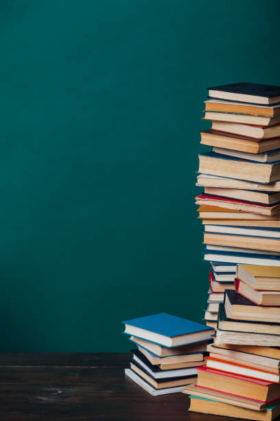 istock school a lot of different educational books on a green background 1217805838