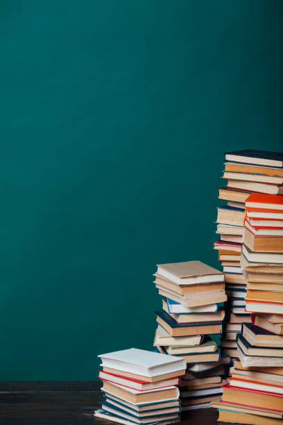 istock school a lot of different educational books on a green background 1217805924