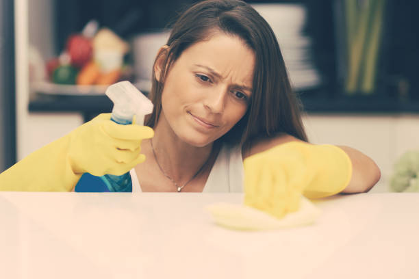 istock Concentrated housewife polishing table surface 1217807129
