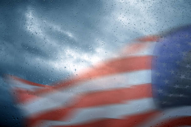 istock American flag in rainy day 1217807225