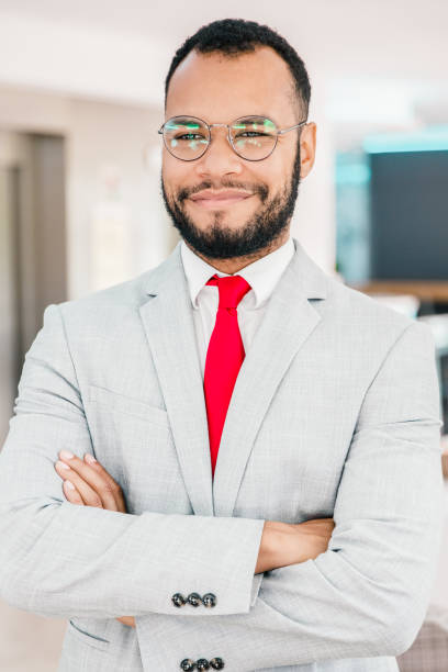 istock Professional young businessman smiling at camera 1217808167