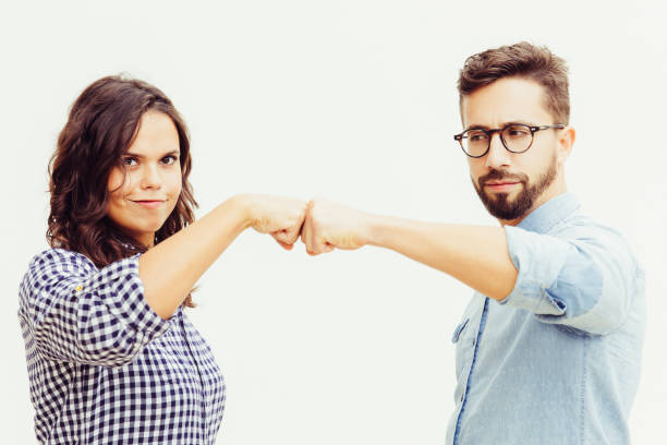 istock Proud couple making fist bump gesture 1217809683