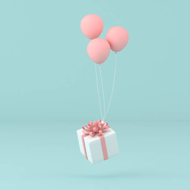 istock minimal conceptual idea of present box floating by balloons on pastel background. 3D rendering 1217809983