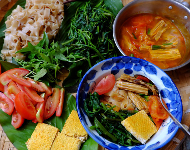 tray of food for vegetarian breakfast, homemade vietnamese dry pancake noodles soup - indochina soup flag national flag imagens e fotografias de stock