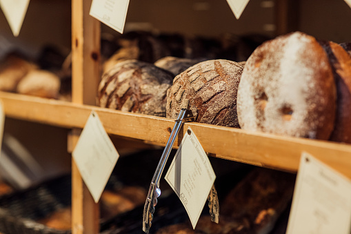 Loaves of bread on shelves at a local small business.