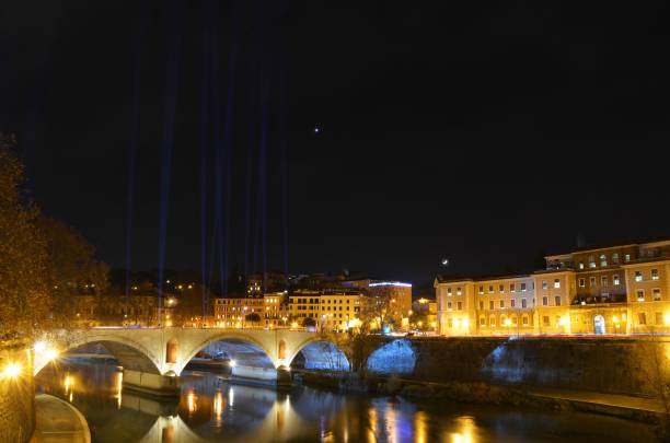 istock Historical Tiber bridge in Rome at night 1217810370