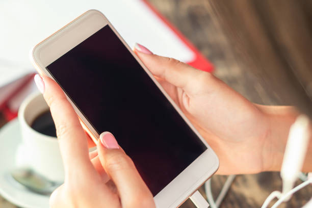 istock Woman hands holding smartphone. 1217811572