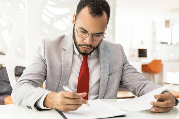 istock Professional businessman signing contract 1217812093