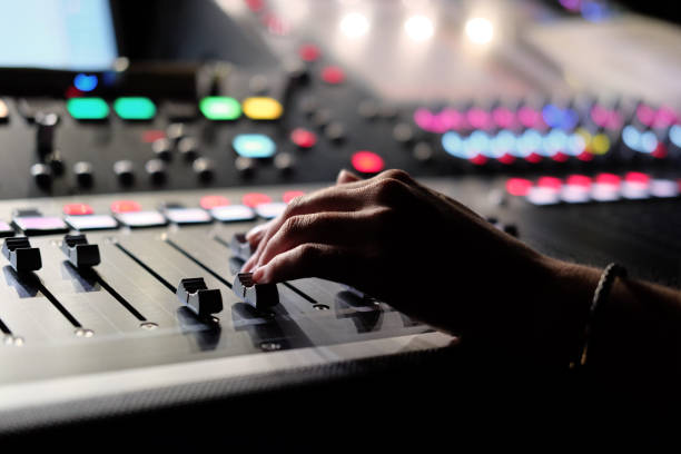 istock Hand on a digital audio mixers faders 1217813203