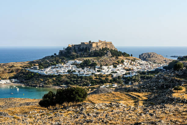 istock City on a hill. A castle surrounded with white houses 1217813811