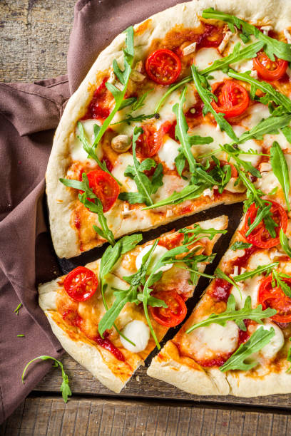 istock homemade pizza with fresh arugula 1217814829