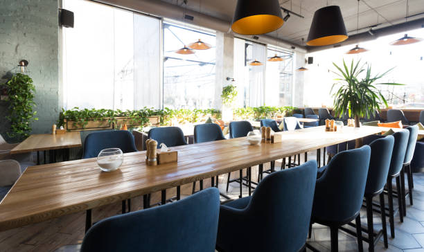 istock Cozy modern interior of restaurant with empty tables 1217815310