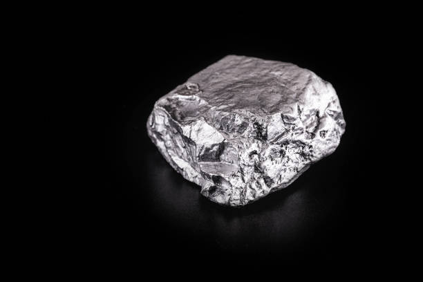 istock large silver stone, rare silver nugget on black background. Gemstone in high resolution, luxury concept. 1217816372