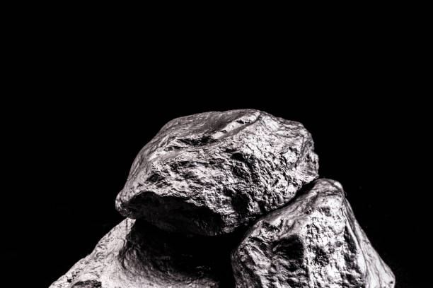 istock large silver stone, rare silver nugget on black background. Gemstone in high resolution, luxury concept. 1217816392