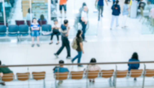 istock abstract blurred people walking at entrance door 1217817701