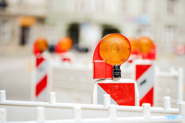 istock Construction site lock with signal lamp on a road. 1217817760