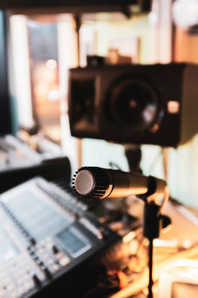 istock Microphone and speaker in colorful music studio 1217817828