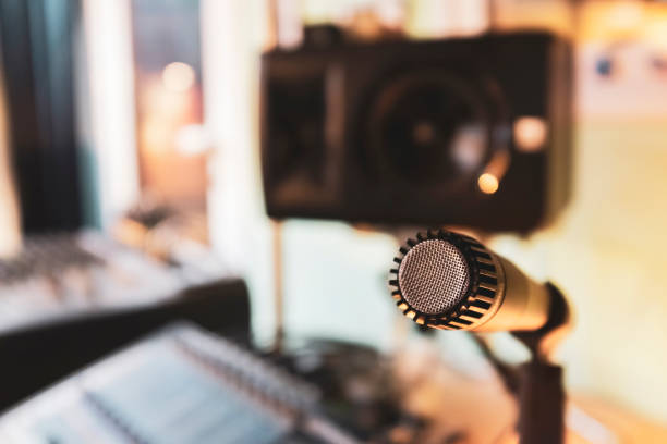 istock Microphone and speaker in colorful music studio 1217817855