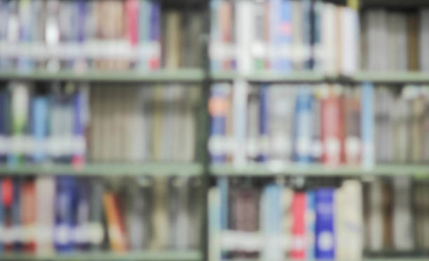 istock Blurred colourful book on shelf of college public library 1217818470