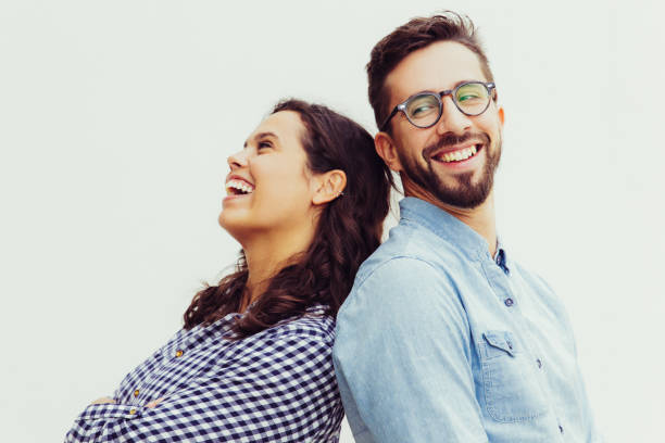 istock Joyful carefree couple leaning on each other 1217818731