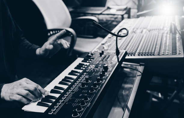 istock musician hands playing keyboard synthesizer for recording in home recording studio 1217820084