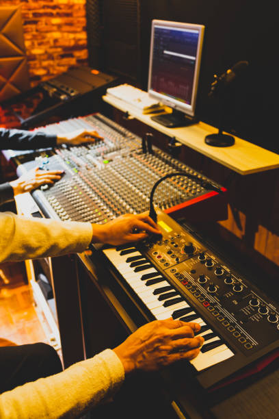 istock professional musician working with sound engineer in recording studio 1217820093