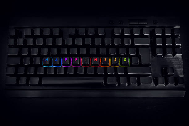 istock Happiness - Written on RGB backlit keyboard 1217820117