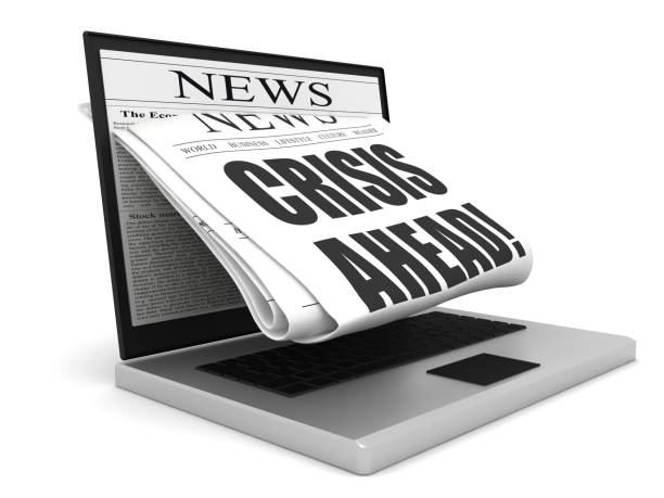 istock Crisis newspaper laptop 1217820315