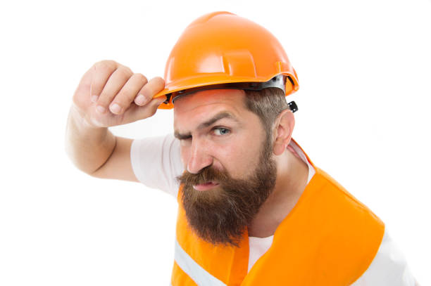 istock Brutal and hardworking. Brutal worker isolated on white. Bearded man with brutal look. Construction worker or builder wear safety hat and vest. Brutal work 1217821281