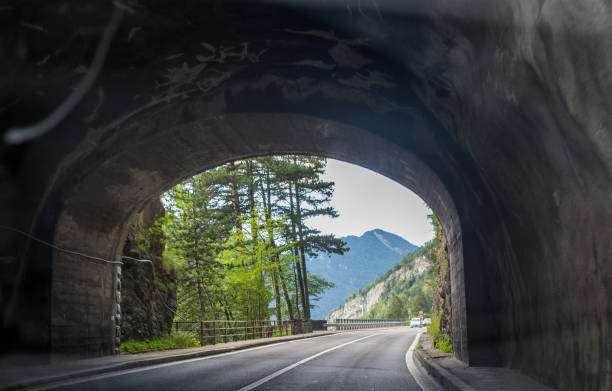 istock Asphalt road in Switzerland, road between the Alps mountains 1217821477