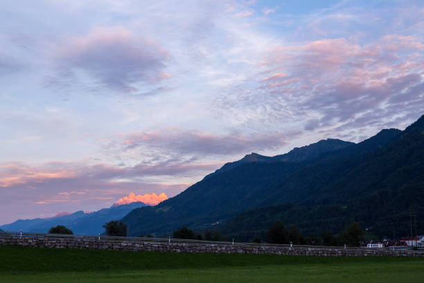 istock Asphalt road in Switzerland, road between the Alps mountains 1217821537