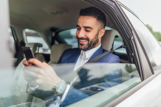 istock Handsome businessman riding in the car 1217822251